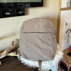 Kipling tan streamlined backpack